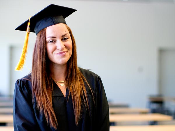 female student wearing graduation gown