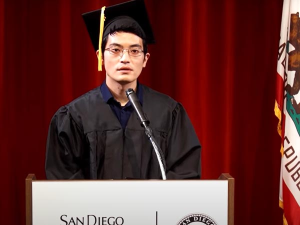 young man in graduation clothes