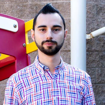Simone Scano standing in front of playground