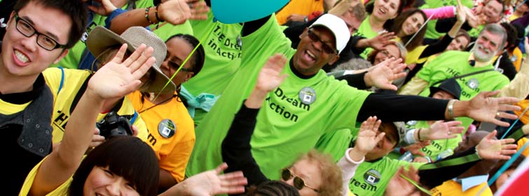 MLK Parade marchers waving their arms