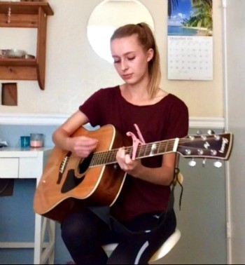 Madeline Plays Guitar