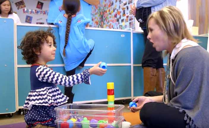 student and child playing