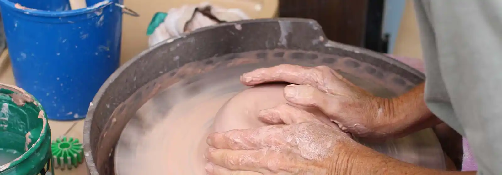 hands shaping clay