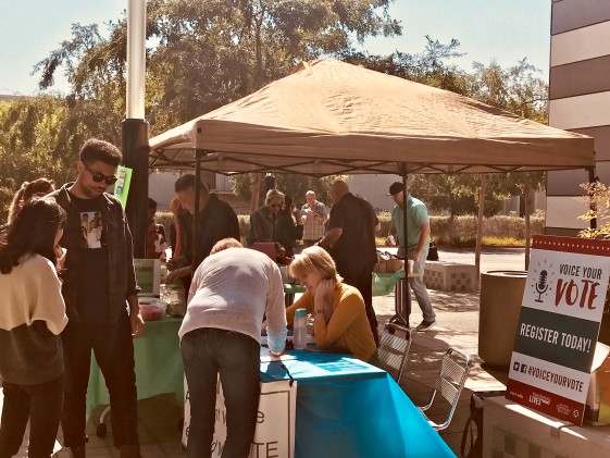 Voter registration tent and group outside north city campus